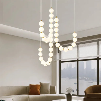 Chandelier Designer ÉclatLuxe Moderne avec Suspension Personnalisable et Éclairage LED pour Intérieurs Contemporains